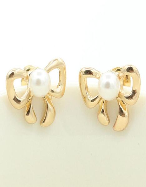 big pearl earrings cute hollow bow knot earring stud gold plated for women girls party ear jewelry 786282, Golden;silver
big pearl earrings cute hollow bow knot earring stud gold plated for women girls party ear jewelry 786282, Golden;silver
