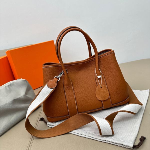fashion tote garden bag genuine leather metal buckle opening women's handbag luxury classic id michafl_kops
fashion tote garden bag genuine leather metal buckle opening women's handbag luxury classic id michafl_kops