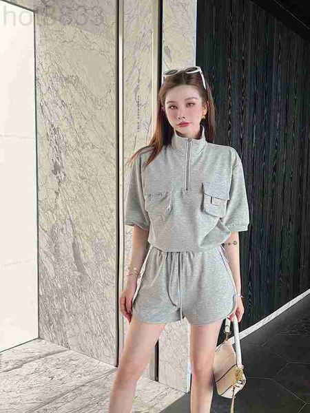 women's tracksuits designer 2023 spring/summer new double pocket metal decoration short sleeve sweater shorts set casual elastic waist, Gray
women's tracksuits designer 2023 spring/summer new double pocket metal decoration short sleeve sweater shorts set casual elastic waist, Gray