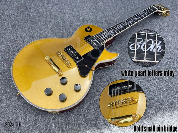 electric guitar gold p90 black soap shape pickups brown back gold parts letters white pearl inlay
electric guitar gold p90 black soap shape pickups brown back gold parts letters white pearl inlay