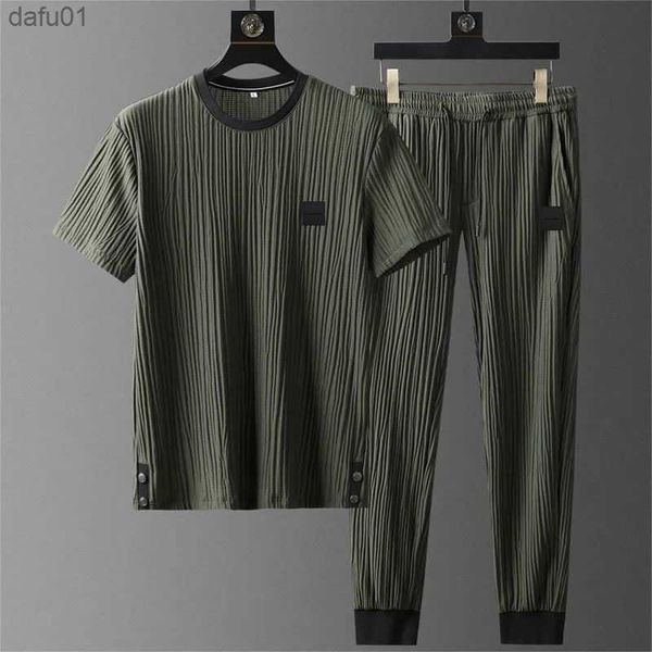 new summer ice silk casual sports suit men's pleated thin t shirt + pants two piece set men's breathable tracksuit l230520, White;black
new summer ice silk casual sports suit men's pleated thin t shirt + pants two piece set men's breathable tracksuit l230520, White;black