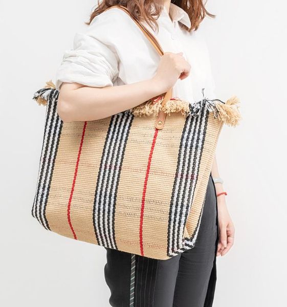 large capacity canvas tote bag women's shoulder bag beach bag tassel embroidery niche design women's bag 
large capacity canvas tote bag women's shoulder bag beach bag tassel embroidery niche design women's bag