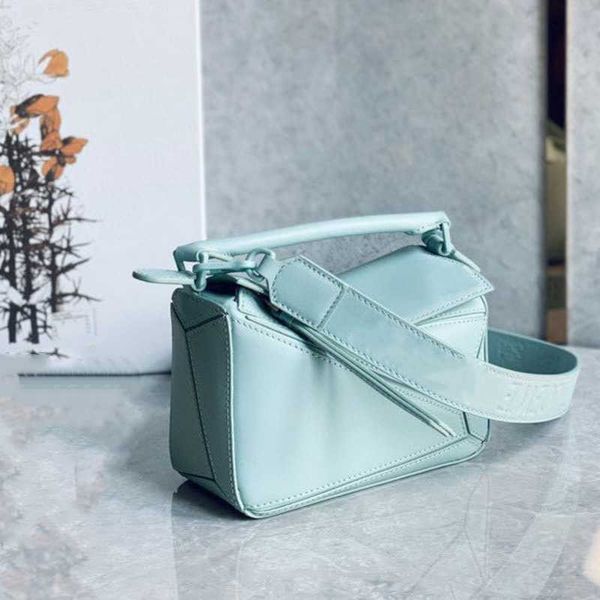 high-end designer bag new wide shoulder strap silk face puzzle geometric bag cowhide mini single diagonal straddle women's genuine leat
high-end designer bag new wide shoulder strap silk face puzzle geometric bag cowhide mini single diagonal straddle women's genuine leat