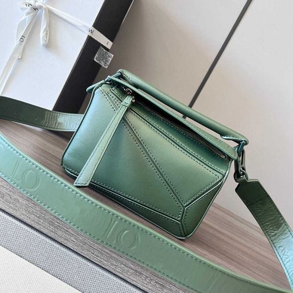 cowhide mini puzzle geometric bag with wide shoulder strap crossbody handheld pillow 
cowhide mini puzzle geometric bag with wide shoulder strap crossbody handheld pillow