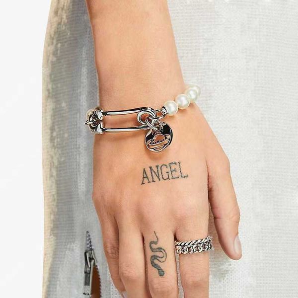 empress dowager west vivi same style couple alloy plating hollow out round label saturn pin pearl bracelet, Golden;silver
empress dowager west vivi same style couple alloy plating hollow out round label saturn pin pearl bracelet, Golden;silver