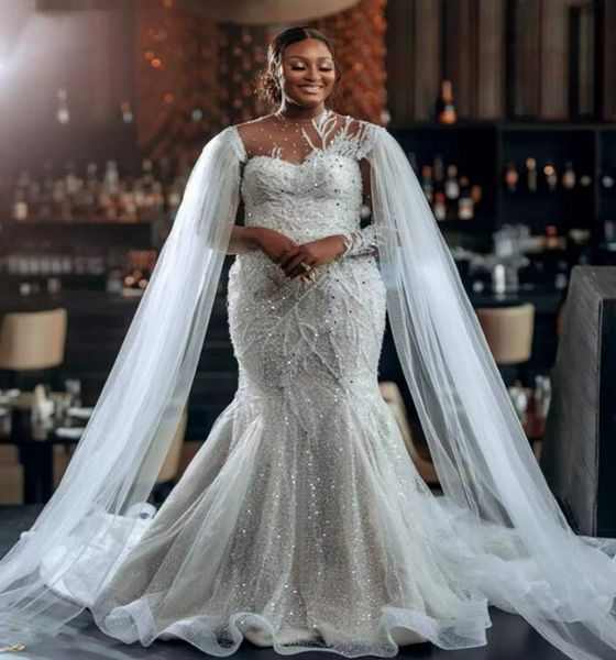 see through beaded high neck african mermaid wedding dress lace appliqued beaded long sleeves bridal gowns with wrap 2023 vestidos de noiva, White
see through beaded high neck african mermaid wedding dress lace appliqued beaded long sleeves bridal gowns with wrap 2023 vestidos de noiva, White
