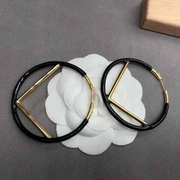 charm large hoop earrings in black gold-tone brass. valentine's day wedding bridal gifts designer earrings for women. classic designer, Golden;silver
charm large hoop earrings in black gold-tone brass. valentine's day wedding bridal gifts designer earrings for women. classic designer, Golden;silver