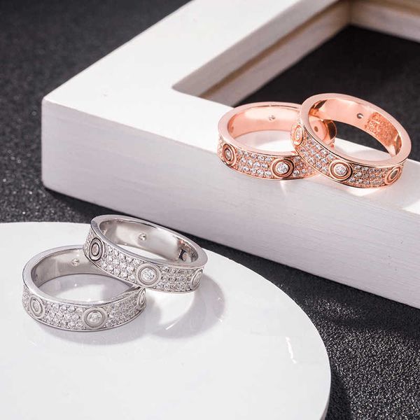 wholesale high-quality s925 sterling silver full sky star three-row diamond love couple ring plated with 18k rose gold screw card
wholesale high-quality s925 sterling silver full sky star three-row diamond love couple ring plated with 18k rose gold screw card