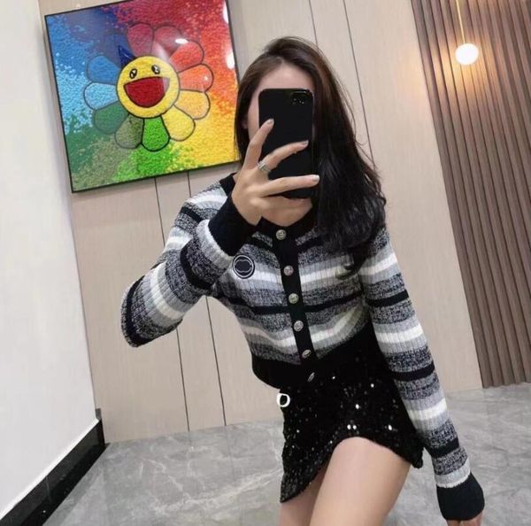 fall designer women knits black white and gray striped cardigan crewneck sweater with buttons c letter embroidery soft and comfortable
fall designer women knits black white and gray striped cardigan crewneck sweater with buttons c letter embroidery soft and comfortable