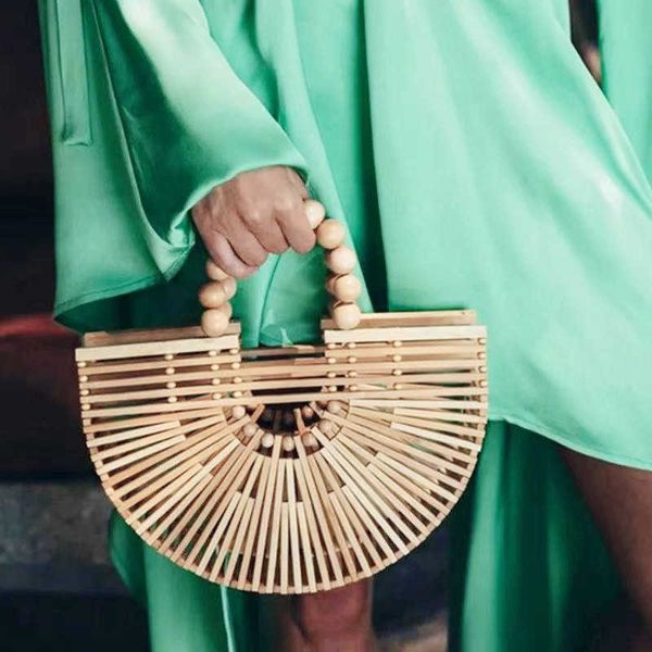 2022 antique new style wooden beads handheld woven bamboo bag for women fashion beach bag 230621
2022 antique new style wooden beads handheld woven bamboo bag for women fashion beach bag 230621