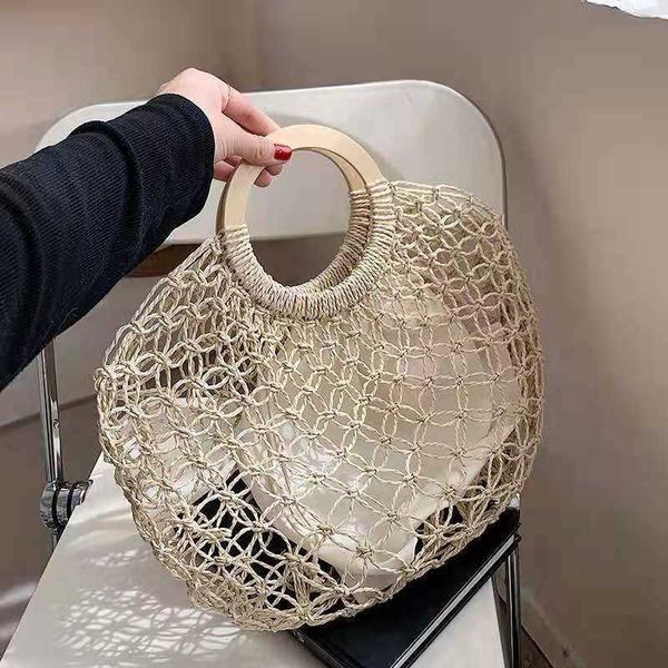 new wooden handle mesh bag hollow grass woven fashion handbag personalized mesh bag 230621
new wooden handle mesh bag hollow grass woven fashion handbag personalized mesh bag 230621