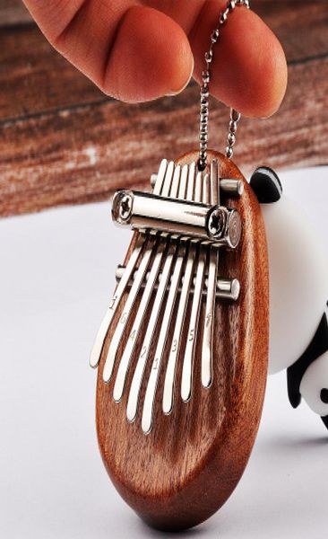 mini mbira kalimba thumb piano 8 key with phonetic symbol mahogany material mini kalimba keychain key buckle6352680
mini mbira kalimba thumb piano 8 key with phonetic symbol mahogany material mini kalimba keychain key buckle6352680