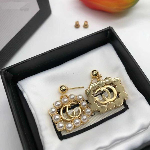 double pearl silver needle fashion trend brass and earrings for women, Golden
double pearl silver needle fashion trend brass and earrings for women, Golden