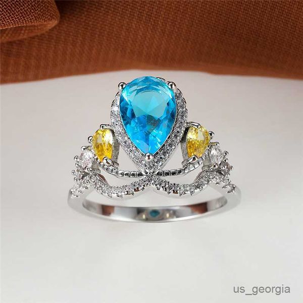 band rings luxury female blue zircon crown engagement ring yellow crystal stone ring classic silver color wedding rings for women r230625
band rings luxury female blue zircon crown engagement ring yellow crystal stone ring classic silver color wedding rings for women r230625