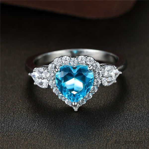 band rings luxury female light blue zircon stone ring promise silver color heart engagement ring vintage wedding rings for women r230625
band rings luxury female light blue zircon stone ring promise silver color heart engagement ring vintage wedding rings for women r230625