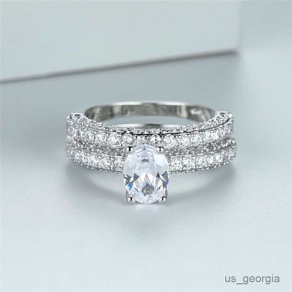 band rings white aaa zircon wedding ring set dainty crystal oval stone double rings boho silver color engagement ring sets for women r230625
band rings white aaa zircon wedding ring set dainty crystal oval stone double rings boho silver color engagement ring sets for women r230625
