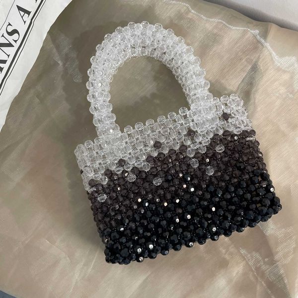acrylic beads pure hand woven bag fashion handheld beaded gradient black and white handbag 230625
acrylic beads pure hand woven bag fashion handheld beaded gradient black and white handbag 230625