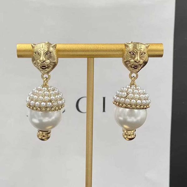 new tiger head water diamond pearl double earstuds brass silver needle earrings, Golden
new tiger head water diamond pearl double earstuds brass silver needle earrings, Golden