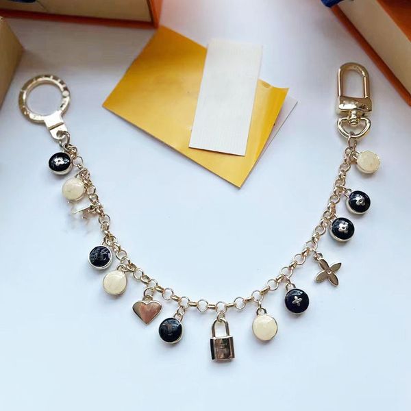 designer keychains bag accessories car bag key chain gift flowers letters design for man woman with box, Silver
designer keychains bag accessories car bag key chain gift flowers letters design for man woman with box, Silver