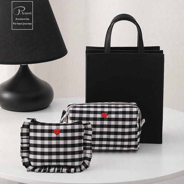 black and white chessboard with large capacity and minimalist style for storing cosmetics portable petty bourgeoisie private aunt's tow
black and white chessboard with large capacity and minimalist style for storing cosmetics portable petty bourgeoisie private aunt's tow