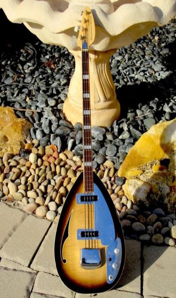 4 strings tobacco sunburst tear drop electric bass guitar semi hollow body single f hole large block inlay nickel hardware8128010
4 strings tobacco sunburst tear drop electric bass guitar semi hollow body single f hole large block inlay nickel hardware8128010