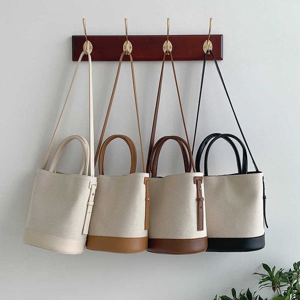 canvas spliced bucket bag for women new fashion versatile commuter bag large capacity portable shoulder bag
canvas spliced bucket bag for women new fashion versatile commuter bag large capacity portable shoulder bag