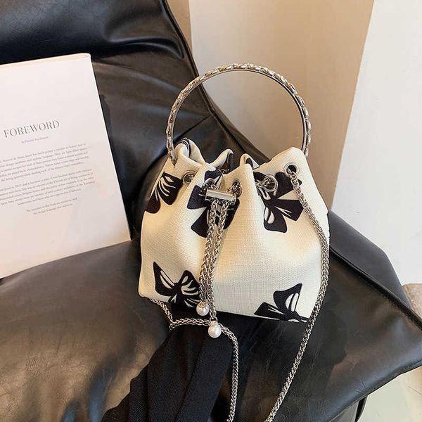 diagonal cross women's bag small fragrance feng shui bucket bag new handle handbag black and white butterfly one shoulder chain bag
diagonal cross women's bag small fragrance feng shui bucket bag new handle handbag black and white butterfly one shoulder chain bag