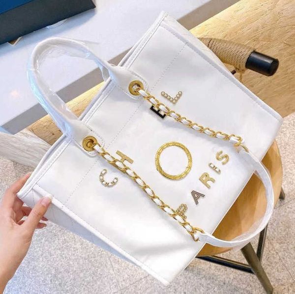 fashion women's luxury hand bags beach bag brand ch metal badge classic totes handbags small mini pearl handbag female capacity large l
fashion women's luxury hand bags beach bag brand ch metal badge classic totes handbags small mini pearl handbag female capacity large l