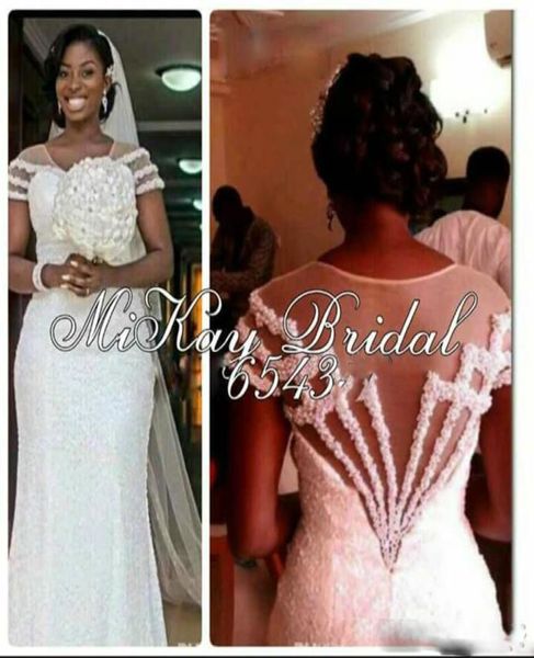 luxury beach lace mermaid wedding dresses 2016 sleeveless backless sweep train tulle applique wedding gowns vestido de noiva1412124, White
luxury beach lace mermaid wedding dresses 2016 sleeveless backless sweep train tulle applique wedding gowns vestido de noiva1412124, White
