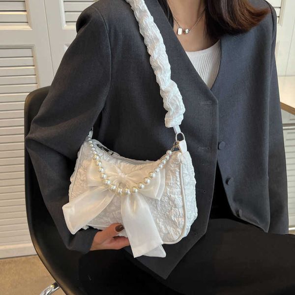 fashionable western design for underarm bag pearl handheld bag for women's summer new crossbody bag tie one shoulder
fashionable western design for underarm bag pearl handheld bag for women's summer new crossbody bag tie one shoulder