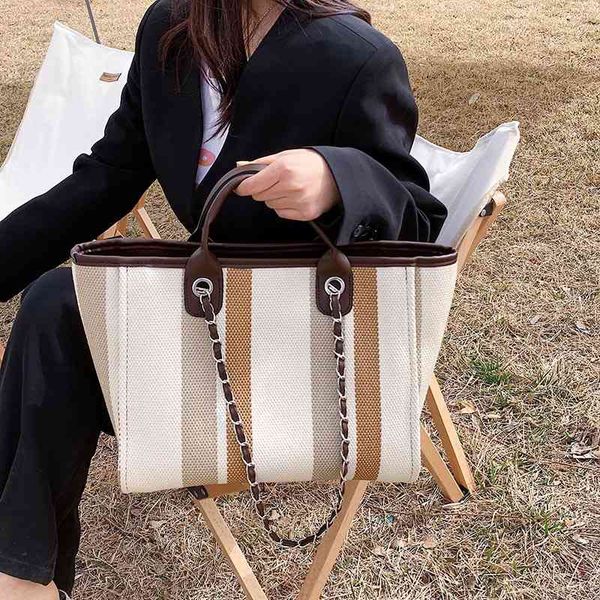 messenger bags canvas tote bag women's new portable contrast stripe sling shoulder large capacity chain messenger handbags
messenger bags canvas tote bag women's new portable contrast stripe sling shoulder large capacity chain messenger handbags