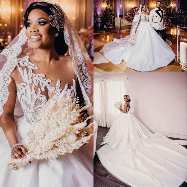 sheer crew neck lace a line wedding dresses arabic dubai illusion applique beaded cathedral train bride gown with bow tie bc14073, White
sheer crew neck lace a line wedding dresses arabic dubai illusion applique beaded cathedral train bride gown with bow tie bc14073, White