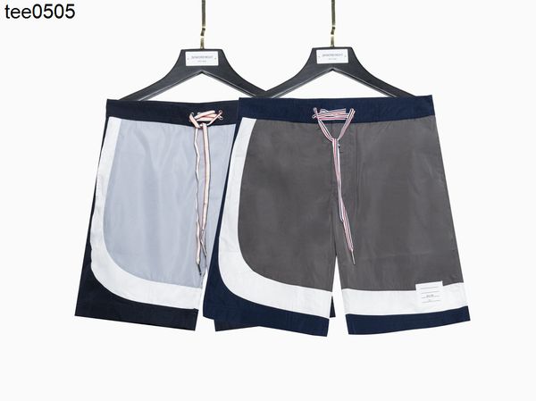 2022 summer new color blocking quick drying casual pants men's and women's beach pants shorts, White;black
2022 summer new color blocking quick drying casual pants men's and women's beach pants shorts, White;black