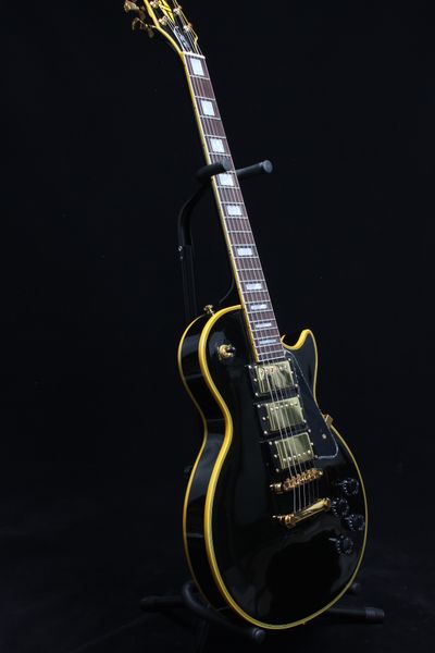 custom electric guitar black color mahogany body 3 pickups yellow binding rosewood fingerboard
custom electric guitar black color mahogany body 3 pickups yellow binding rosewood fingerboard