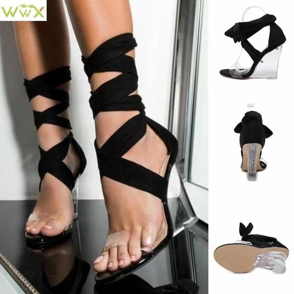 the designer's cross-strap and open-toe wedge sandals are the perfect holiday gift, Black