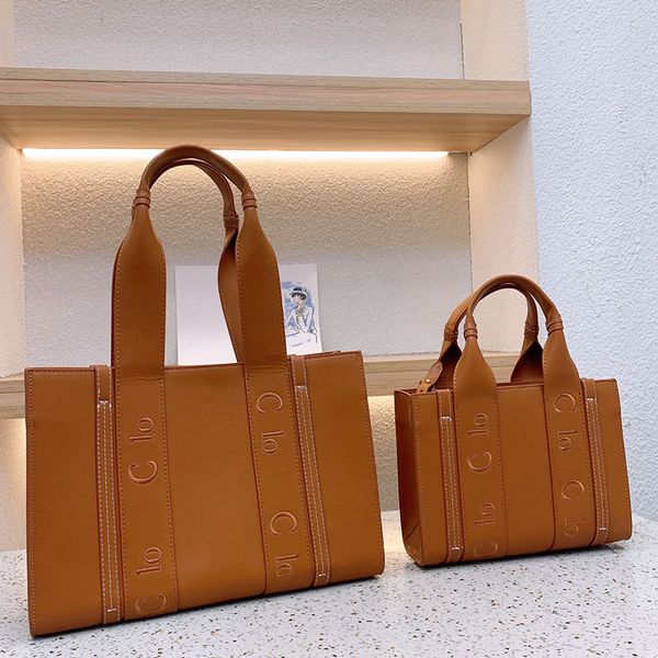 the tote bag designer tote women shoulder crossbody handbag fashion all-match classic solid color leather totes 
the tote bag designer tote women shoulder crossbody handbag fashion all-match classic solid color leather totes