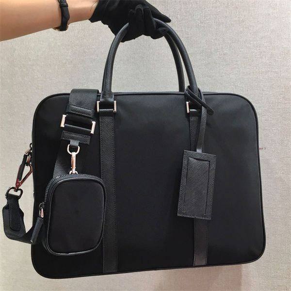 re nylon saffiano leather briefcase work bags tote enameled metal triangle logo print nylon lining adjustable shoulder strap name tag crossb
re nylon saffiano leather briefcase work bags tote enameled metal triangle logo print nylon lining adjustable shoulder strap name tag crossb