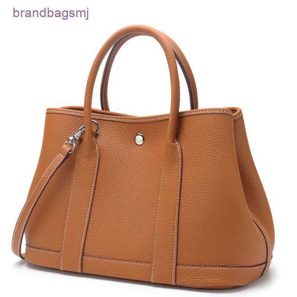 bag herme leather garden bag women's hand layer cowhide litchi pattern simple leisure shopping gardenparty
bag herme leather garden bag women's hand layer cowhide litchi pattern simple leisure shopping gardenparty