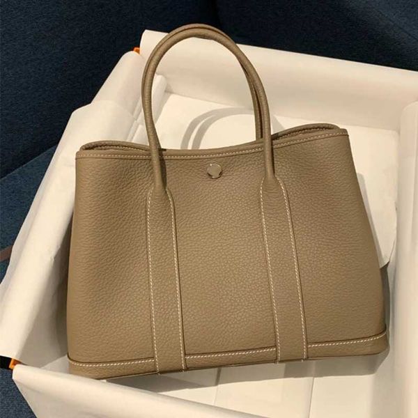 h gardens luxurys handbags 2023 new togo leather women's bag shoulder tote versatile garden handheld big shopping bucket with real logo
h gardens luxurys handbags 2023 new togo leather women's bag shoulder tote versatile garden handheld big shopping bucket with real logo