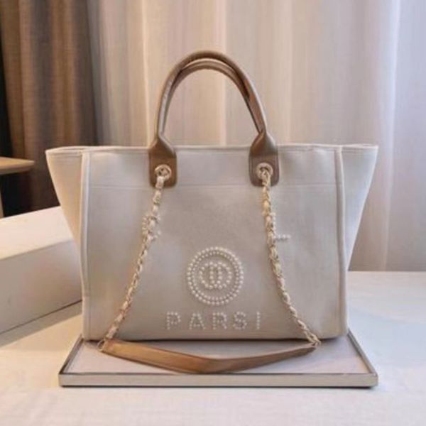 luxury women's fashion handbags evening bags brand ch pearl tote canvas beach bag designers female portable large capacity big handbag 
luxury women's fashion handbags evening bags brand ch pearl tote canvas beach bag designers female portable large capacity big handbag