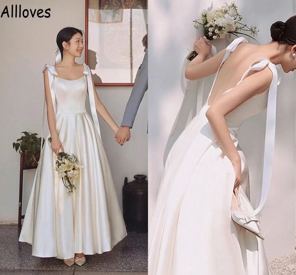 simple satin a line wedding gowns spaghetti straps with bow ribbon backless boho garden bridal dress ankle length fashion brides engagement, White
simple satin a line wedding gowns spaghetti straps with bow ribbon backless boho garden bridal dress ankle length fashion brides engagement, White