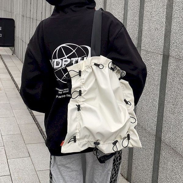 waist bags style cool japanese solid color single shoulder canvas bag messenger student men and women personality drawstring 220829
waist bags style cool japanese solid color single shoulder canvas bag messenger student men and women personality drawstring 220829