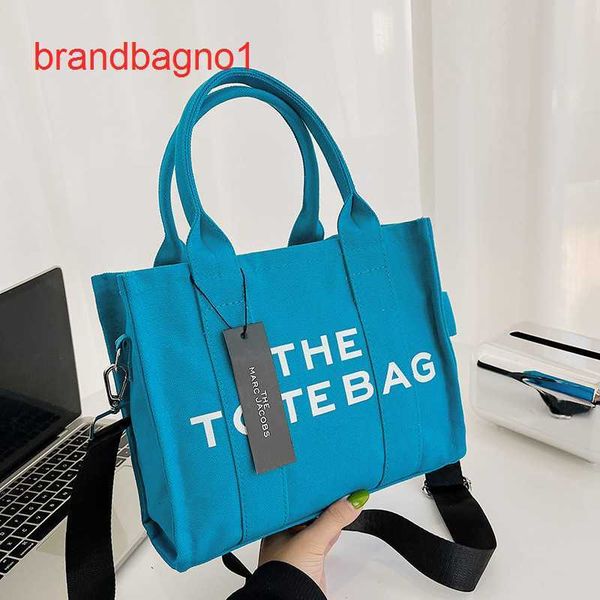 designer totes bags price large capacity bag women's 2023 new tote simple solid color letters hand messenger canvas
designer totes bags price large capacity bag women's 2023 new tote simple solid color letters hand messenger canvas