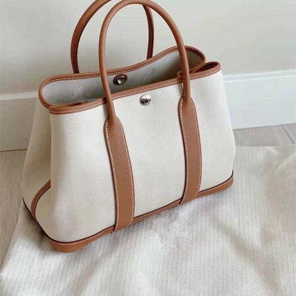 herme handbags garden party 2022 new women's single shoulder diagonal span tote bag versatile canvas portable shopping bucket have logo
herme handbags garden party 2022 new women's single shoulder diagonal span tote bag versatile canvas portable shopping bucket have logo