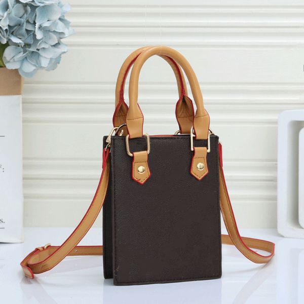 2023 classic brown flower score mini luxury brand small tote allmatch highend leather luxury designer bag
2023 classic brown flower score mini luxury brand small tote allmatch highend leather luxury designer bag
