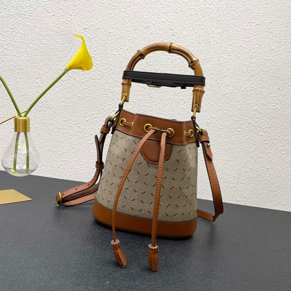 mini bucket bag bamboo handle double letter hardware handbag purse genuine leather crossbody bags drawtring totes adjustable shoulder strap
mini bucket bag bamboo handle double letter hardware handbag purse genuine leather crossbody bags drawtring totes adjustable shoulder strap