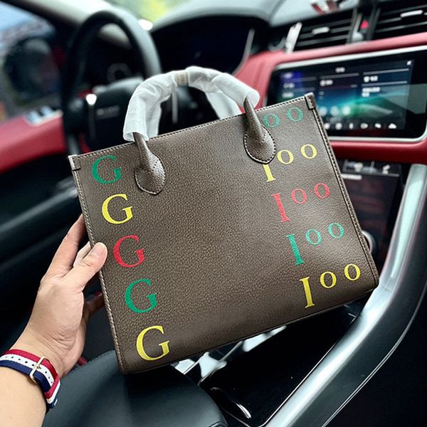 31cm handbag tote shopping bag brown crossbody bags cowhide leather fashion letters large capacity pocket gold hardware removable wide strap
31cm handbag tote shopping bag brown crossbody bags cowhide leather fashion letters large capacity pocket gold hardware removable wide strap