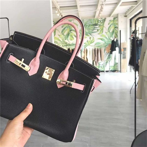 design purse and winter new cowhide women's bag black bumping powder layer litchi pattern portable shoulder
design purse and winter new cowhide women's bag black bumping powder layer litchi pattern portable shoulder