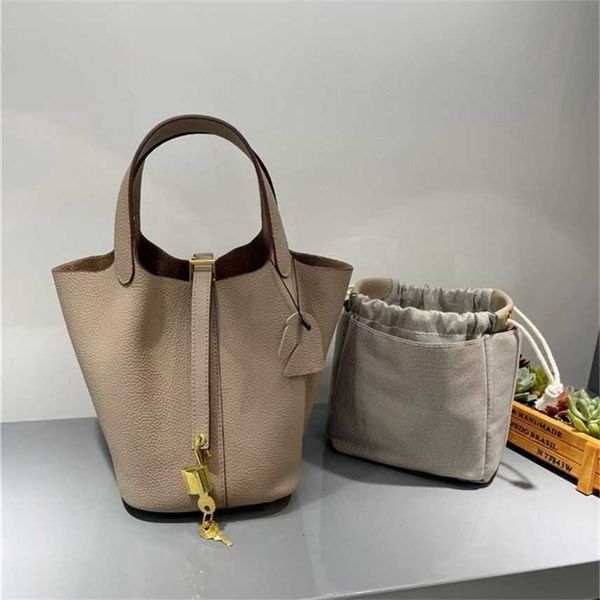 design purse new gold button vegetable basket togo pattern layer cowhide bucket steamed stuffed bun mother bag portable female
design purse new gold button vegetable basket togo pattern layer cowhide bucket steamed stuffed bun mother bag portable female