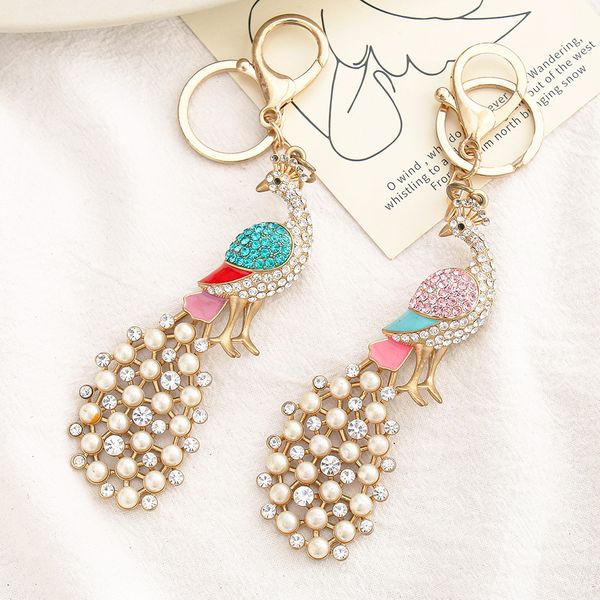 creative diamond set pearl peacock keychain pendant fashion alloy cute cartoon keychains for bags hanging jewelry gift accessories, Silver
creative diamond set pearl peacock keychain pendant fashion alloy cute cartoon keychains for bags hanging jewelry gift accessories, Silver